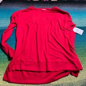 Red top, never worn, tags on item. Fabric is extremely soft.